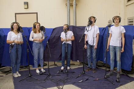 Group of five students in music recording studio