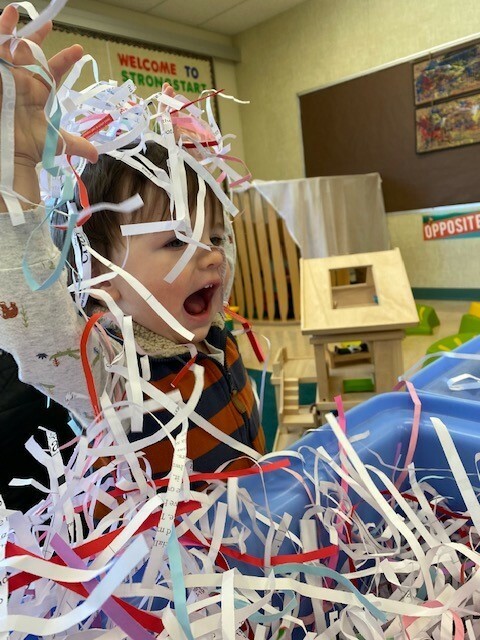 Student with paper streamers